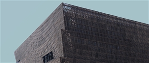 The top part of the buildig of the National Museum of African American History and Culture in Washington, DC. Photo by Clark Van Der Beken via Unsplash.